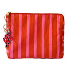 Striped red and pink cosmetic pouch with snake beaded keychain on a white background