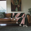 Throw blanket on leather sofa